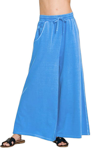 Blue wide-leg pants worn by a person on a white background