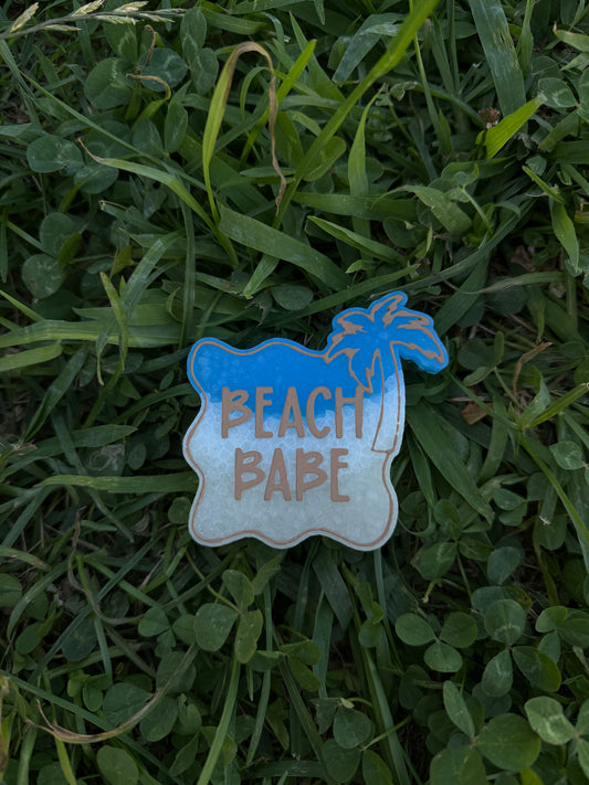 Freshie with 'Beach Babe' text on grass