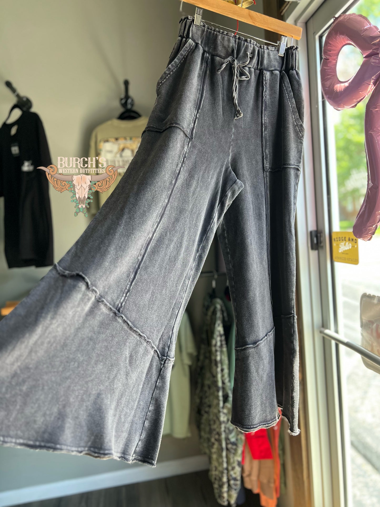 The Mae Black Mineral Wash Flare Raw Hem Pants