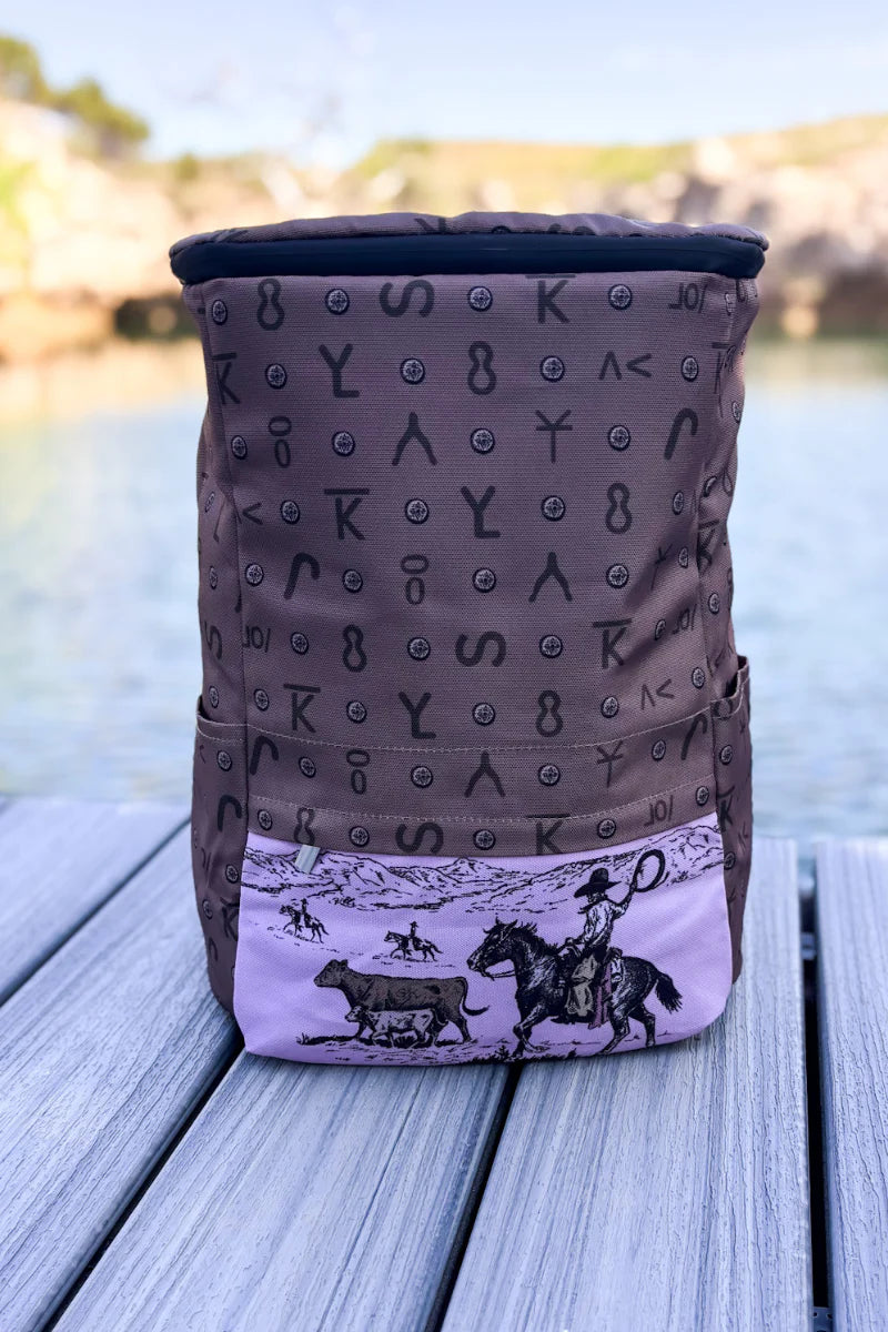 Western cooler backpack with horse herding cattle on front pink pocket
