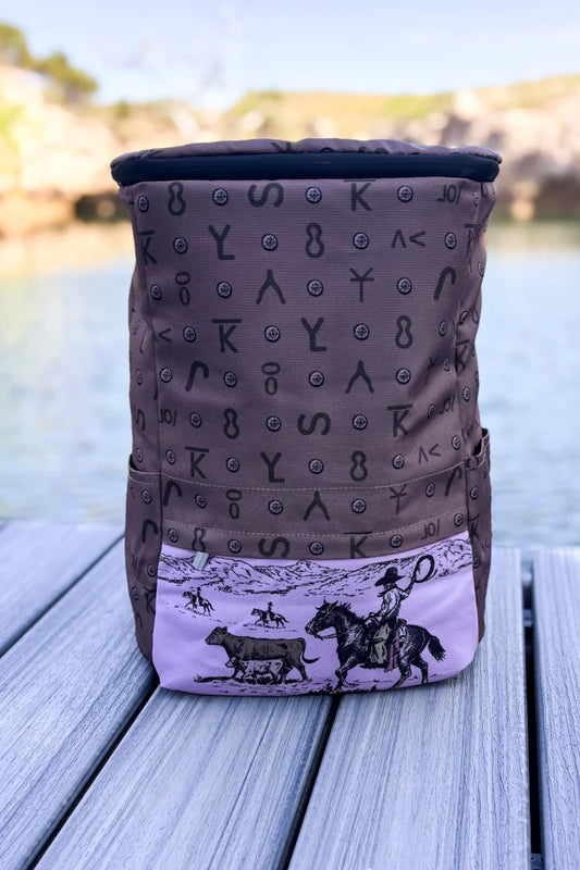 Western cooler backpack with horse herding cattle on front pink pocket
