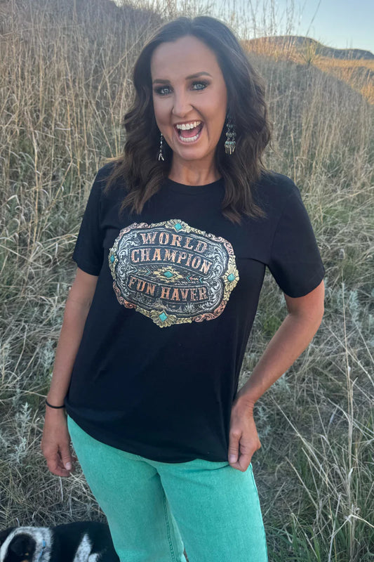 Woman wearing a black t-shirt with a graphic design outdoors