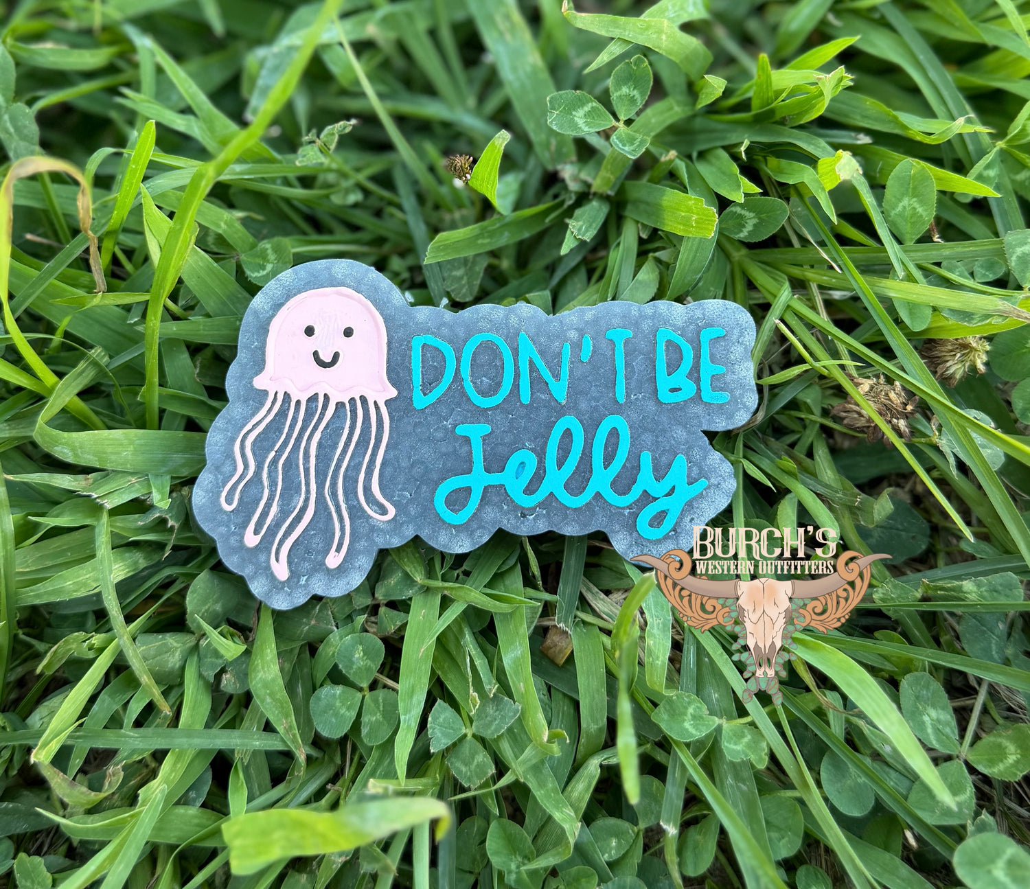 Freshie with jellyfish design and text 'Don't Be Jelly' on grass