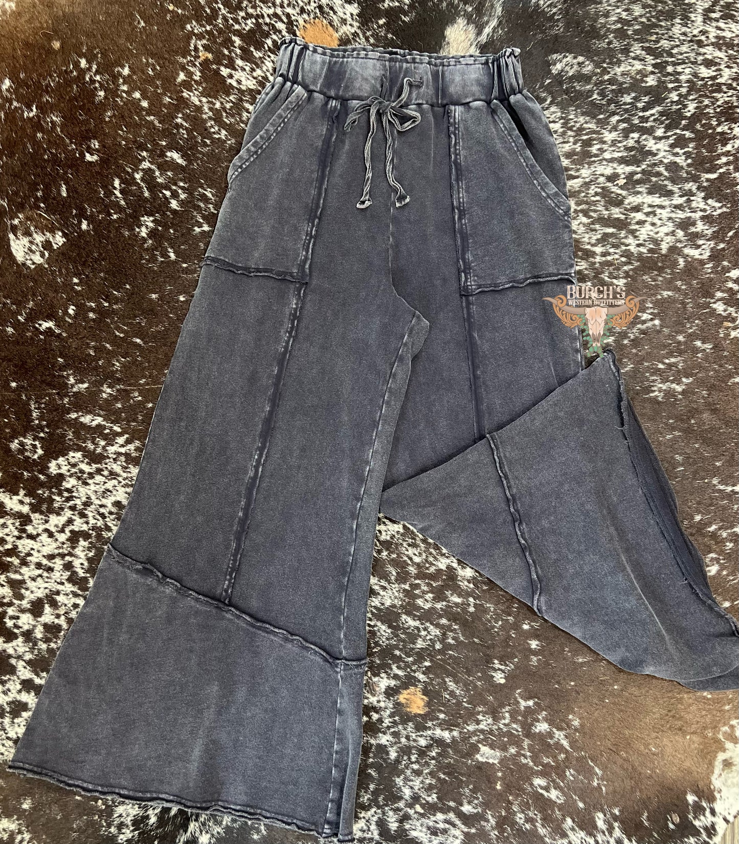 The Mae Black Mineral Wash Flare Raw Hem Pants