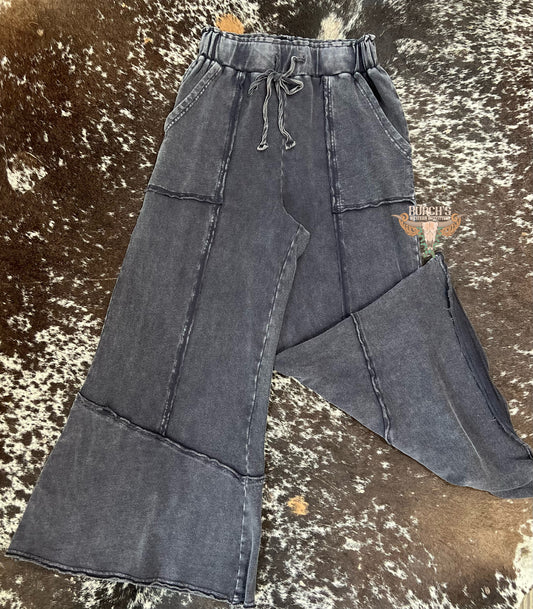 The Mae Black Mineral Wash Flare Raw Hem Pants