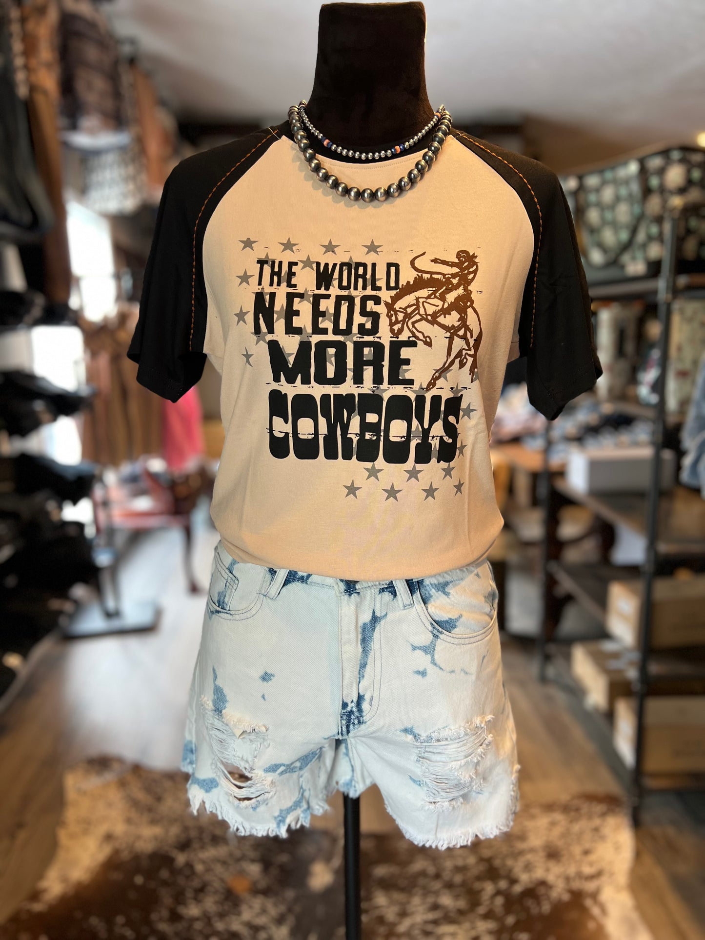 The World Needs More Cowboys Top