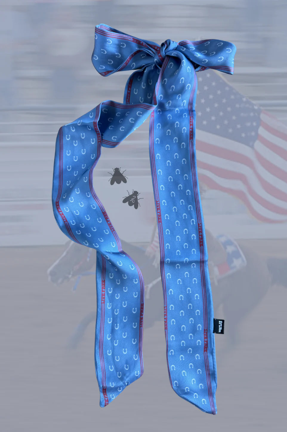 Blue patterned scarf with a bow on a blurred background